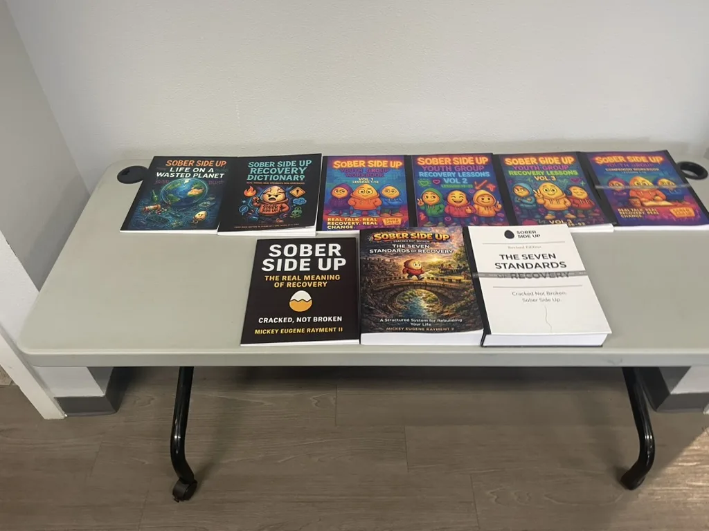 Sober Side Up recovery books displayed on a table